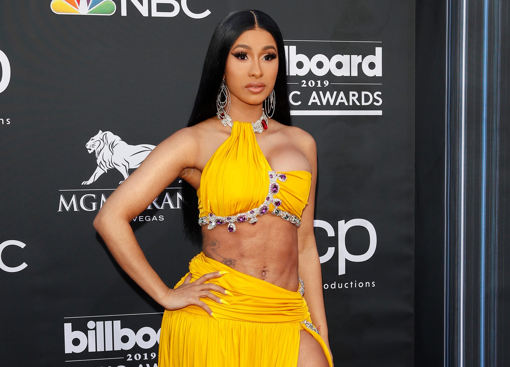 Cardi B shows off the results of her boob job and lipo as she